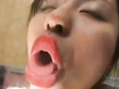Asian girl licking window