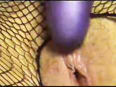 Sexy Suz doing dildo in her fishnet stocking