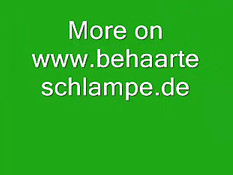 German hairy bitch plays with cucumber