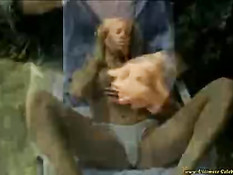 Blonde masturbating at the pool