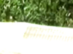 Alena posing between sunflowers