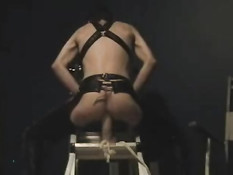 Prisoner with a huge dildo