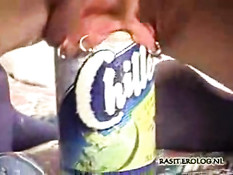 Bottle in her pierced pussy