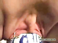 Bottle in her pierced pussy