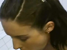 Pretty girl giving blowjob in bathroom