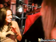 Giving the stripper a handjob