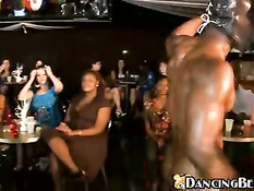 Girls having fun with masked ebony stripper