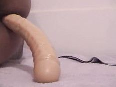 Girl pushes out 10 inch dildo