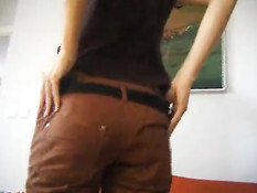 Young woman rubs on couch