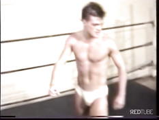 Two dudes wrestle and enable their bodys