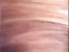 Красивая девушка ласкает член языком и большими сиськами