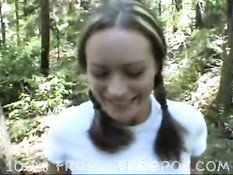 Pigtail Girl gives blowjob in the forest