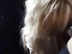 Блондиночка в очках трахается в одежде и получает сперму в лицо