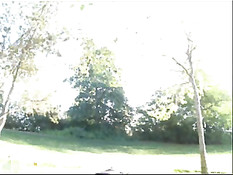 Девушка обнажается в онлайн порно чате на фоне цветущего леса