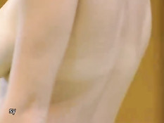 Corina doing topless gymnastics