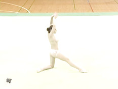 Corina doing topless gymnastics