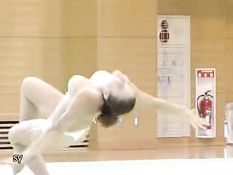 Corina doing topless gymnastics