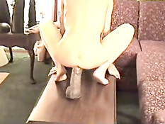 Humping a huge dildo