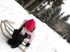 Cute girl masturbates on sledge 