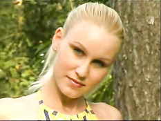 Blond chick shows her pussy outdoor